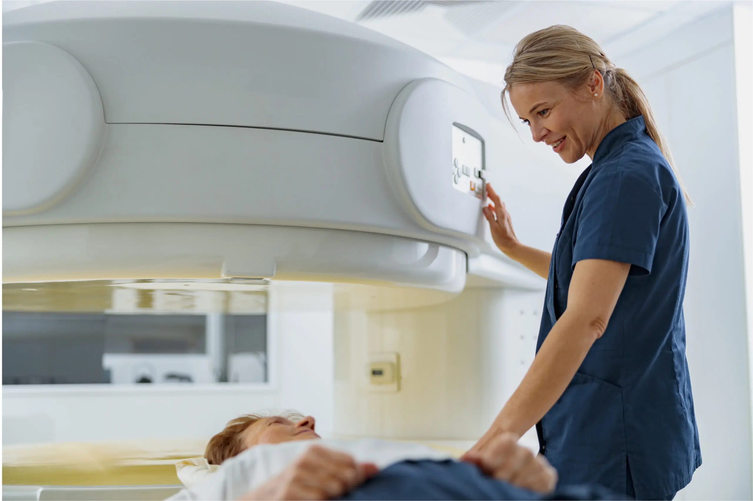 Technician operating MRI machine